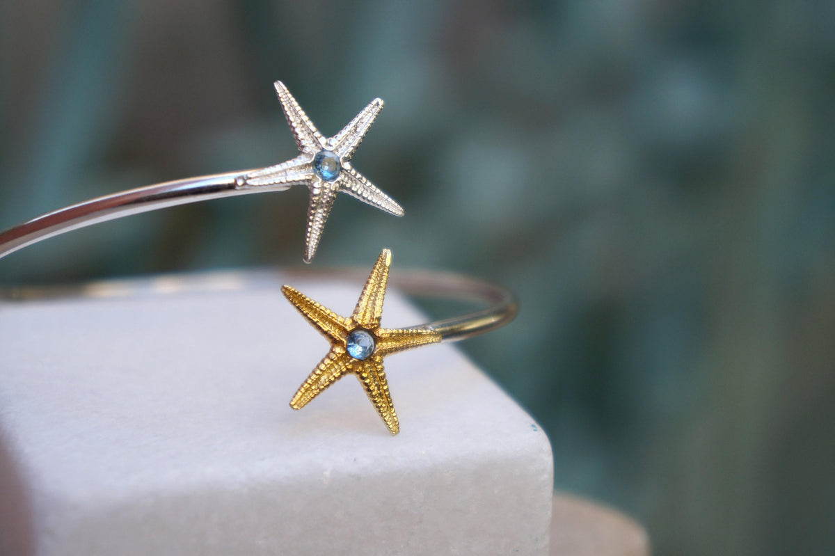 Silver Starfish Bracelet: Adjustable Cuff with Blue Zircon