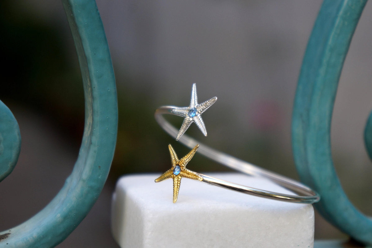 Silver Starfish Bracelet: Adjustable Cuff with Blue Zircon